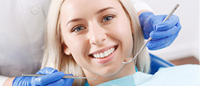 blonde woman receiving dental care