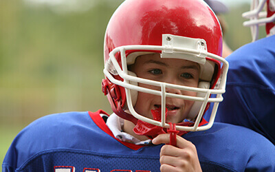 Boy in football gear