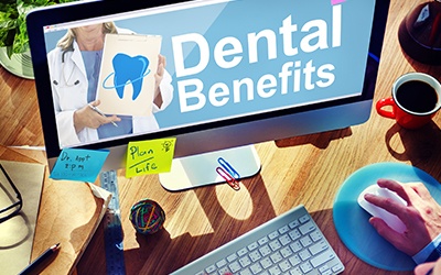 Person looking at dental benefits on computer