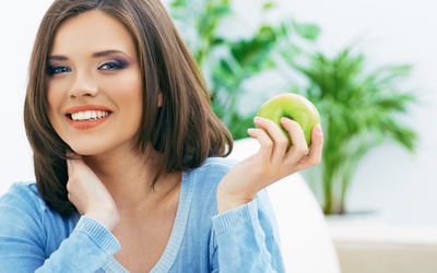 woman holding an apple