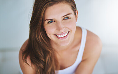 blue-eyed woman smiling