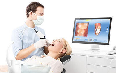 Dentist viewing teeth on monitor