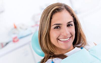 Woman smiling sitting in dental chair